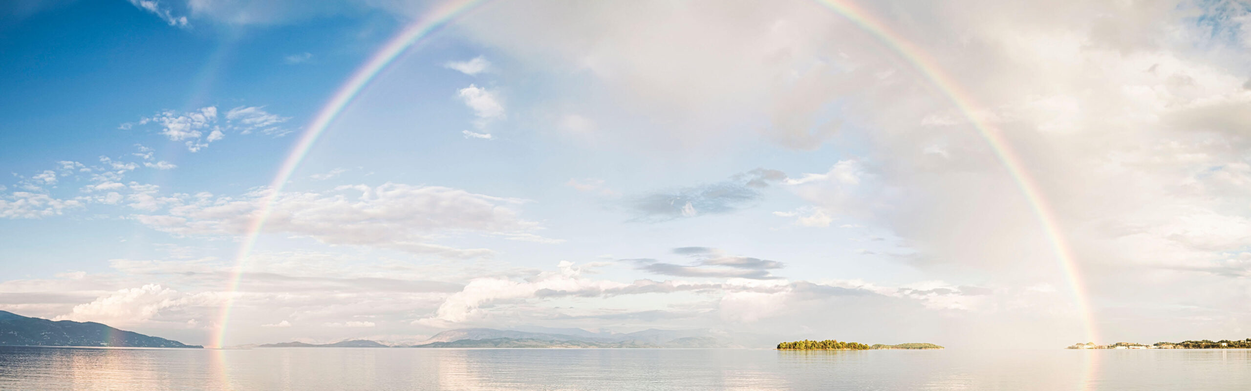 Rainbow arch over water